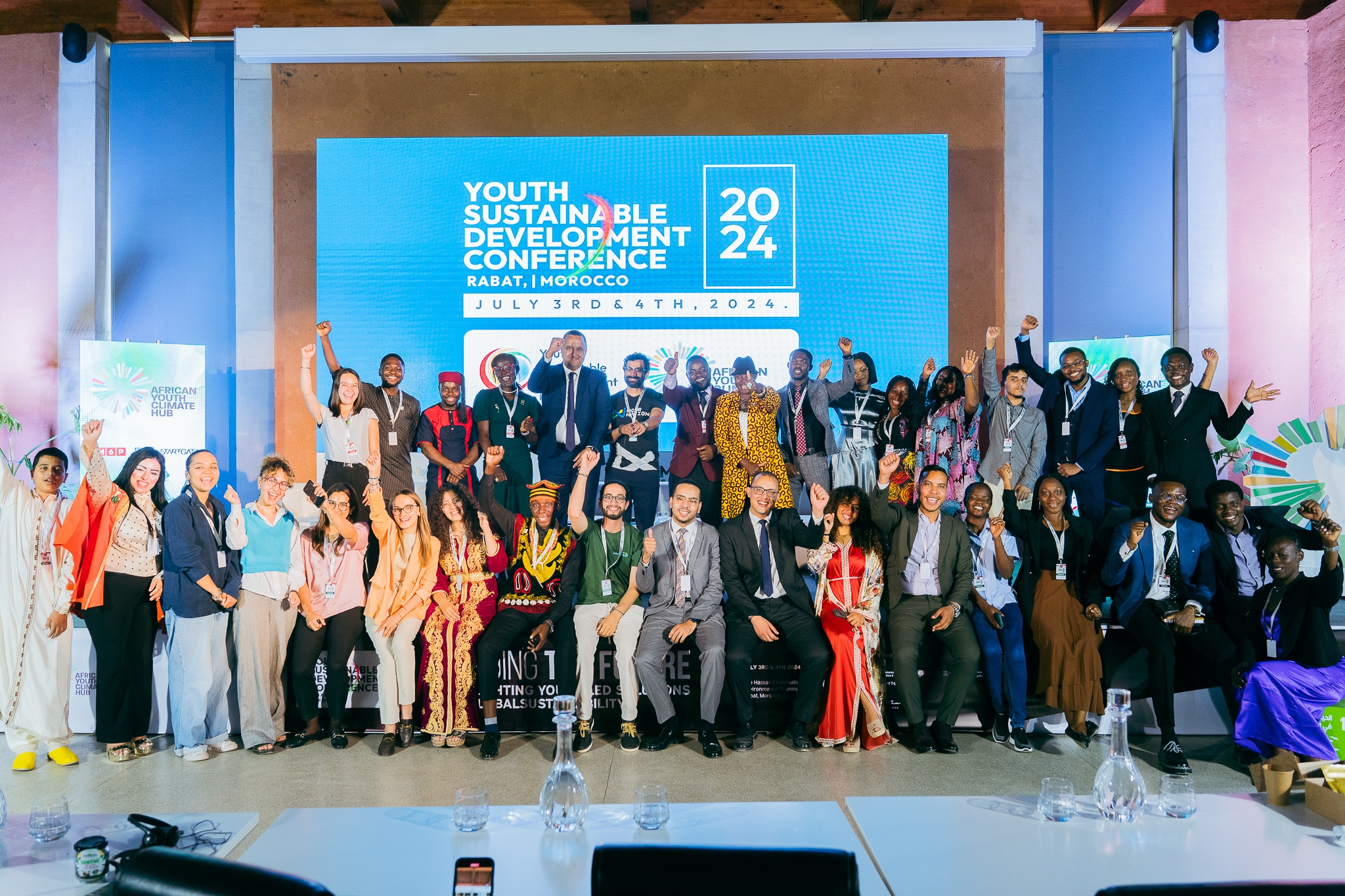 Conference attendees and panelists gather following an event on the intersection of sustainability and sports. This event was highly relevant, as preparations for the 2030 World Cup in Morocco are underway. Event planners intend to prioritize environmental considerations.